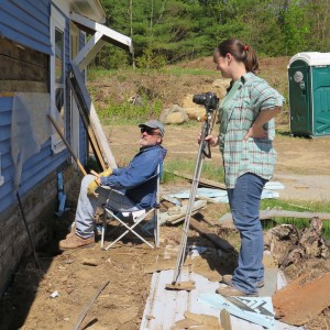 Students Rick Kipphut and Erin Hunt contemplate the newly exposed wall sheathing in the ell.